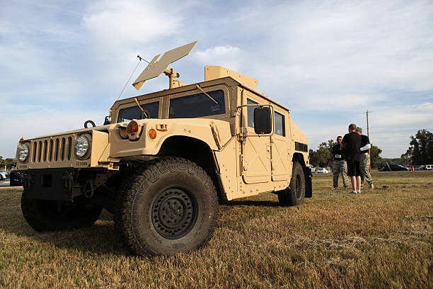 Humvee with three male participants before Mud Run 2013 stock photo