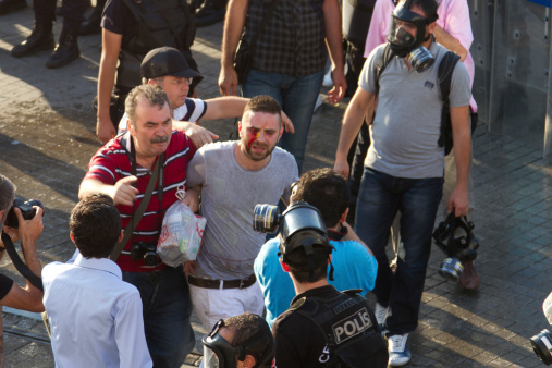 Istanbul, Turkey - July 06, 2013: Man shot from his face by tear gas capsule during protests. People are protesting the prohibition of entry to Gezi Park since 15 June 2013