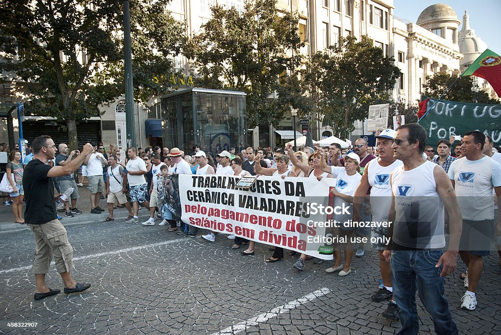 Protest against government spending cuts and tax rises Porto, Portugal - September 15, 2012: People protesting against government spending cuts and tax rises in Aliados square, Porto on September 15, 2012. Allied Forces Stock Photo