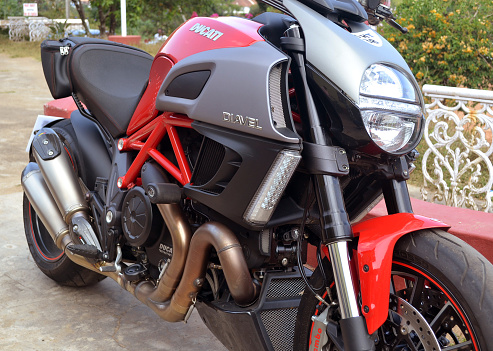 Madikeri, Karnataka, India -january 5, 2013: Side view of a red beautiful Ducati motorbike in detail.