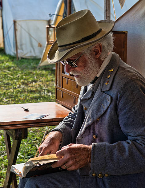 Confederate General Robert E. Lee Sharpsburg, Maryland, USA - September 16, 2012: A living history actor portrays Confederate General Robert E. Lee during the 150th Anniversary reenactment of the battle of Antietam. The actual battle occurred on September 17th, 1862 where during the bloodiest day in American history, over 23,000 combatants lost their lives. the general lee stock pictures, royalty-free photos & images