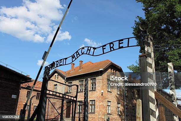 Entrance Gate To Auschwitz Concentration Camp Stock Photo - Download Image Now - Arbeit macht frei, Auschwitz Concentration Camp, Barbed Wire