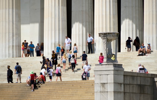 Washington DC, USA - June 4, 2012: People at the Lincoln Memorial in downtown Washington DC. Built to honor America's 16th president, it is a popular tourist destination, as well as the location of Martin Luther King Jr.'s \