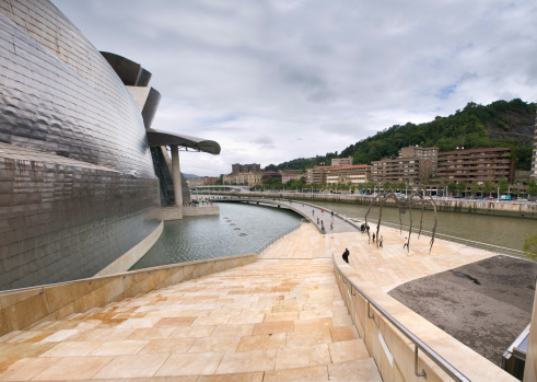 Bilbao, Spain - July 19, 2011. The Guggenheim Museum and the NerviAn river.