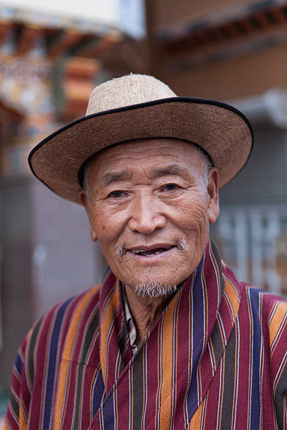 Portrait of a Buthanese man wearing traditional dress stock photo