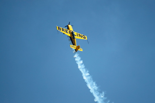 Rome, Italy - June 3, 2012: A Breitling Extra 300 airplane performs at the Rome International Air Show on June 3, 2012 in Rome, Italy