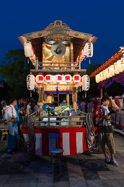 Nagoya, Japan - July 20, 2013 : People at the summer festival in Nagoya Port, Nagoya, Aichi Prefecture, Japan. The decorated float is for the night parade in the summer festival.