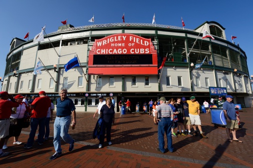 Chicago, USA- July 10,2013: Wrigley Field Stadium - Home of Chicago Cubs - major league baseball team of Chicago and people waiting in line in front of it. Wrigley Field is one of the oldest baseball fields in the country.
