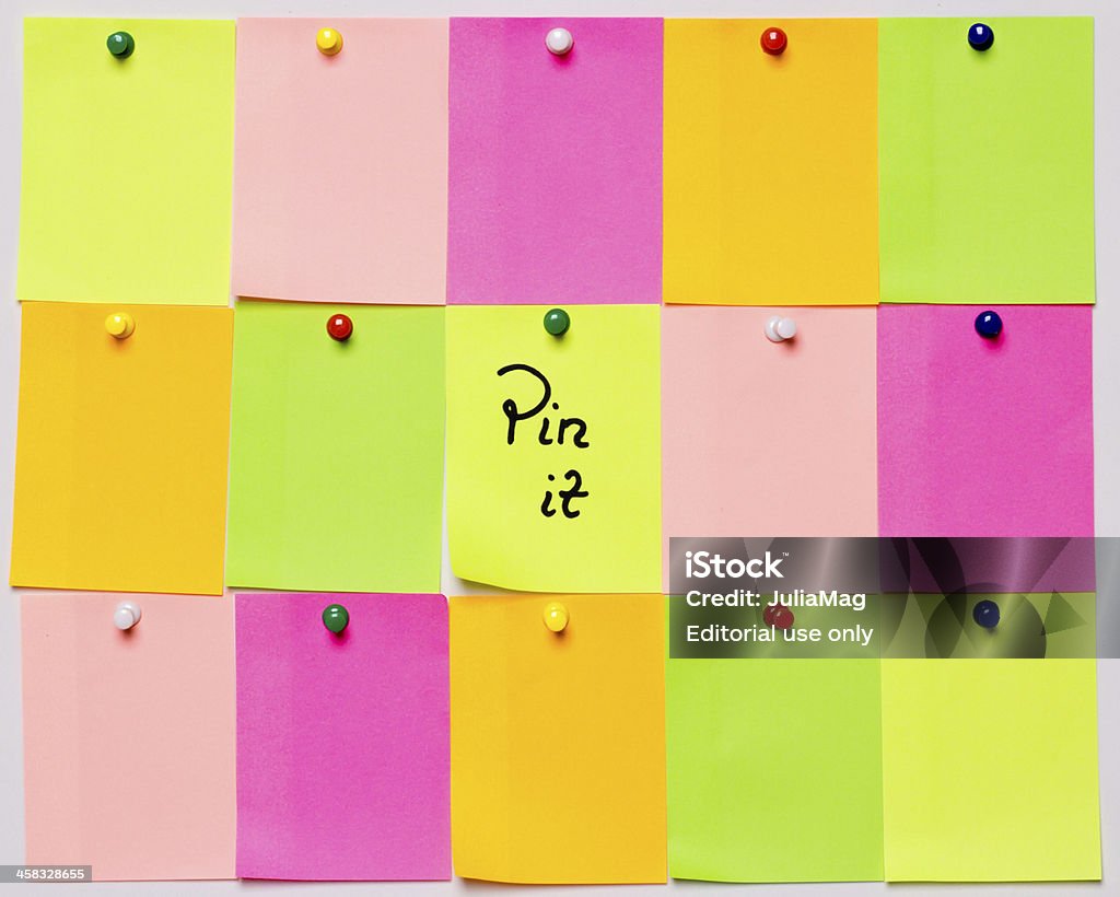 Pinterest Wuhan, China - June 21, 2012: "Pin it" written on adhesive notes and pinned on a bulletin board. Pinterest is a social networking website where users post images that they find interesting. Adhesive Note Stock Photo