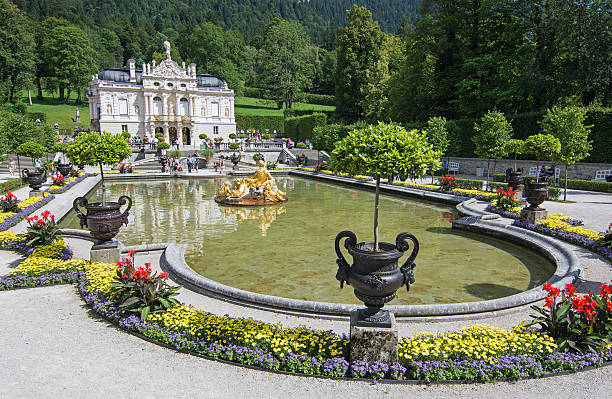 Tourists from different countries looking at Linderhof castle. stock photo