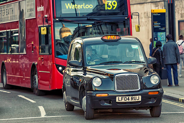 ロンドンの黒色タクシー - bus taxi london england double decker bus ストックフォトと画像