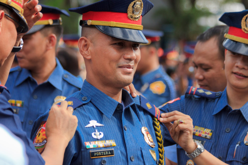 Manila, Philippines- December 14, 2012: Oath taking in Camp Crame of the new members of Philippine National Police in the technical working group. Total of 1,014 has been added to the officer corps of the after they were commissioned under the 2012 lateral entry.