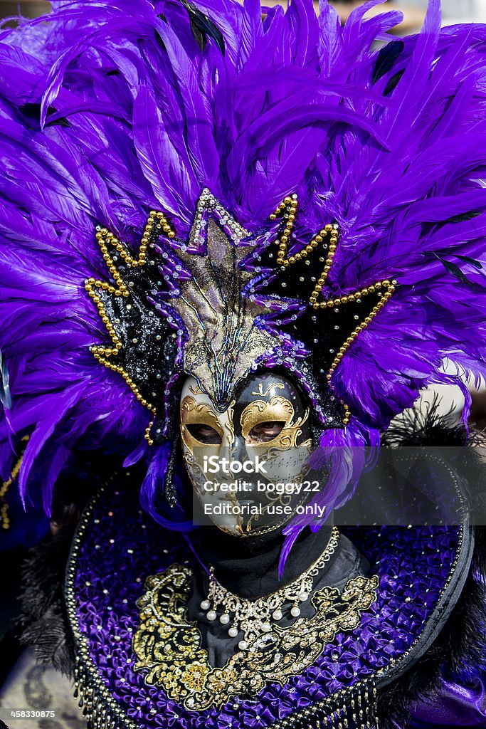 Traditional venetian carnival mask Venice, Italy - February 9, 2013: Unidentified person with traditional Venetian carnival mask in Venice, Italy. At 2013 it is held from January 26th to February 12th. Beauty Stock Photo