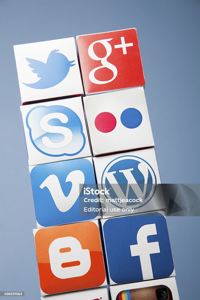 Social media background London, United KIngdom- September 24, 2013: Social media logos printed onto handmade cubes. photographed in a studio. Social media uses web and mobile technology to connect people Arrangement Stock Photo