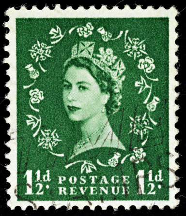 Exeter, United Kingdom - February 1, 2010: British One and Half Pence Green Used Postage Stamp showing Portrait of Queen Elizabeth 2nd, printed and issued from 1952 to 1965