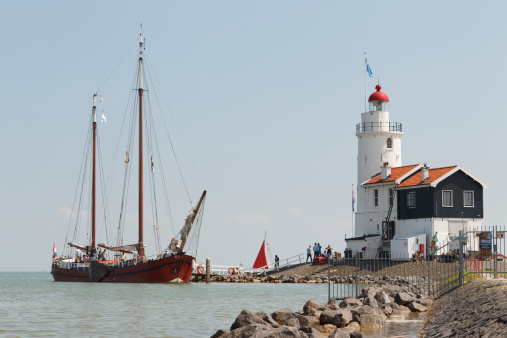 Marken, The Netherlands - July 15, 2013: An old wooden sailboat visits the \