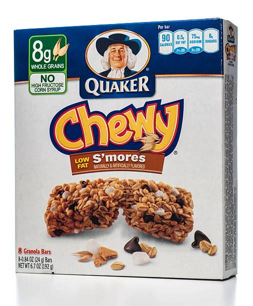 Quaker Chewy Low Fat granola bars box Miami, USA - June 09, 2013: Quaker Chewy Low Fat 8 granola bars box. Quaker brand is owned by PepsiCo, Inc. chewy stock pictures, royalty-free photos & images