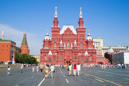 Moscow, Russia - July 24, 2011: People walking on Red Square - the heart of the capital of Russia - near Kremlin towers and Historical museum.