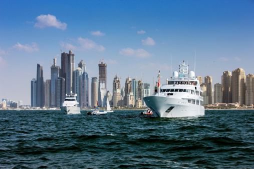 Dubai, UAE - November 27, 2010: Yacht racing and power boating are very popular leisure activities of the Dubai Marina