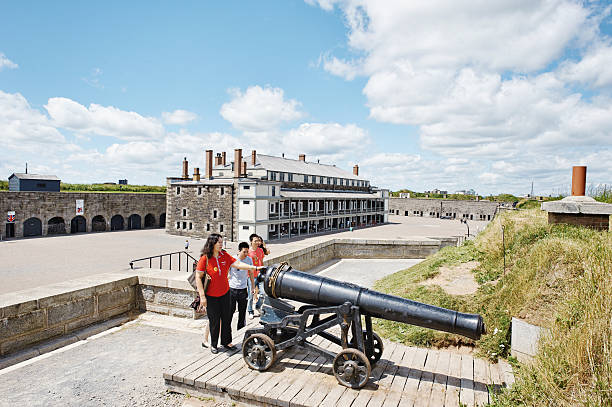 Halifax,Nova Scotia, Canada - July 24, 2011: View from the rampart with cannon on the courtyard of the Halifax Citadel National Historic Site with historical building. Small group of tourists are admiring the cannon. Famous landmark in Halifax.
