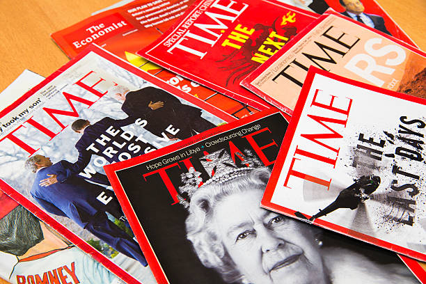 Popular Magazines Shanghai, China - Oct 2, 2013: Popular Magazines in English language displayed, including Time and The Economist. Magazines are a great way to learn news, culture and short stories. They generate the majority of their income through advertising. newspaper seller stock pictures, royalty-free photos & images