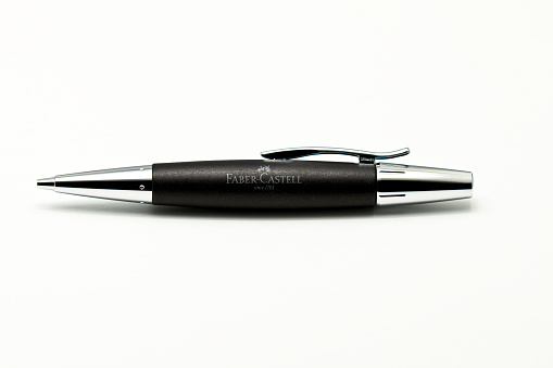 Ascoli Piceno, Italy - 14 December, 2012: Pearwood black barrel with polished chrome-plated metal ends and spring-loaded clip. Durable 1.4 mm Polymer lead, hardness B. Extra large replaceable eraser under cap. Twist cap to extend the lead.