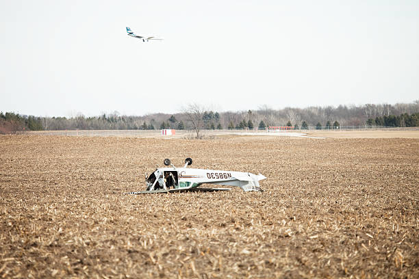 Florence, Italy - March 12, 2004: German private jet went off the runway during take off. Firefighters engaged in rescue operations after the crash.