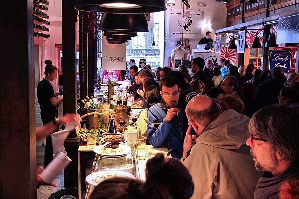 Madrid, Spain - October 21, 2012: People eat at Mercado San Miguel on October 21, 2012 in Madrid. According to Tripadvisor, it is the 2nd top shopping destination in Madrid.