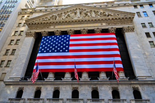 New York, USA - February 4, 2009: The American flags decorate the facade of the New York Stock Exchange on Wall Street