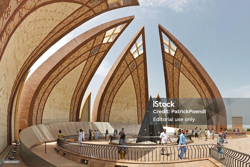 Tourists at the Pakistan Monument, Islamabad Islamabad, Pakistan - July 16, 2011: Tourists visit the Pakistan Monument. The monument represents Pakistan's progress as a developing country, its provinces and its territories. Islamabad Stock Photo