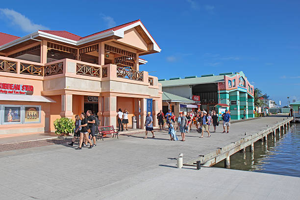 Belize City, Belize - December 26, 2011: Cruise ship passengers head back to the tenders by the shops at the Belize City Cruise Ship Terminal on the day after Christmas, December 26, 2011. The cruise ship terminal has shops, immigration and access to numerous tours throughout the rest of the country.