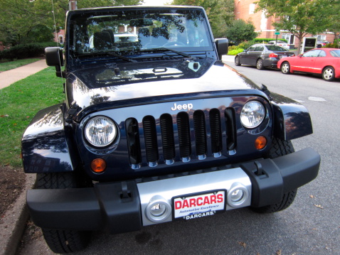 Washington D.C., USA-September 29, 2012:  This jeep sahara found in a washington dc neighborhood looks like it is ready for off roading.  The jeep sahara has the new pentastar v6 engine which improves performance.