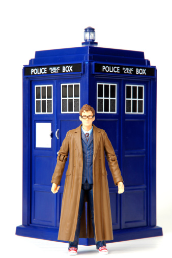 Vancouver, Canada - June 5, 2013: Toys of the tenth doctor and the TARDIS from the Doctor Who television series posed against a white background. Doctor Who is created by the BBC.