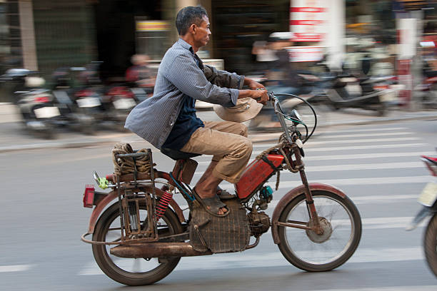 Man on an old moped. stock photo