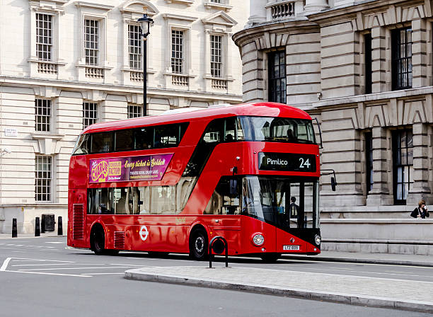 New London Bus London, UK - July 5, 2013: One of the new London Buses on a road en route to Hampstead Heath. These modern looking buses which currently run from Hampstead to Pimlico, are billed as the greenest and cleanest in the world and have been in operation since 2012. The bus is sometimes referred to as the 'Boris Bus' due to it being introduced whilst Boris Johnson was Mayor of London. boris bus stock pictures, royalty-free photos & images