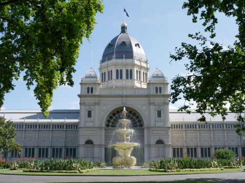 Melbourne, Australia - January 26, 2012: The Royal Exhibition Building is set in the Carlton Gardens, a world heritage site, and  was completed in 1880 for the Melbourne International Exhibition. It was home to Australia's first federal parliament in 1901, This aspect faces south towards the CBD.