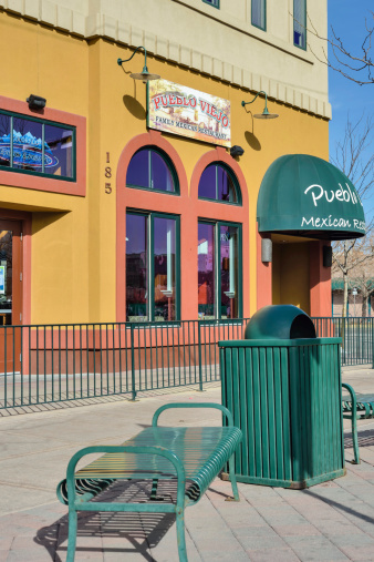 Fort Collins, Colorado, USA - March 13, 2013: A beautiful day on College Avenue, the main street of Fort Collins, Colorado in front of a Mexican restaurant. Situated at the foot of the Rocky Mountains, Fort Collins is a college town with a thriving downtown, and a large Hispanic community.