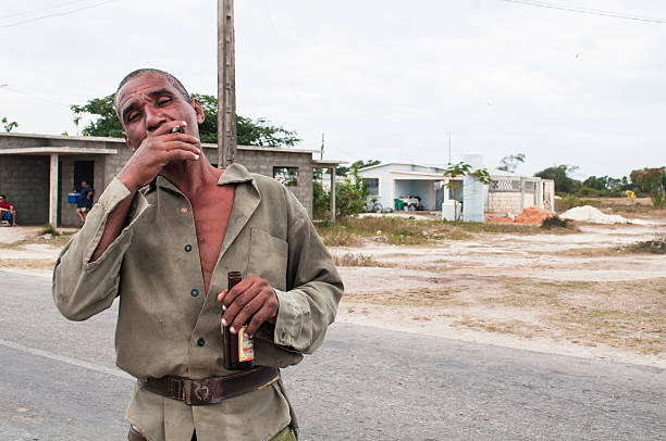 Playa Giron Playa Girón, Cuba, December 26, 2012. A resident of the village of Playa Giron, on Bahia de Cochinos, with shirt Cuba's revolutionary army. bay of pigs invasion stock pictures, royalty-free photos & images