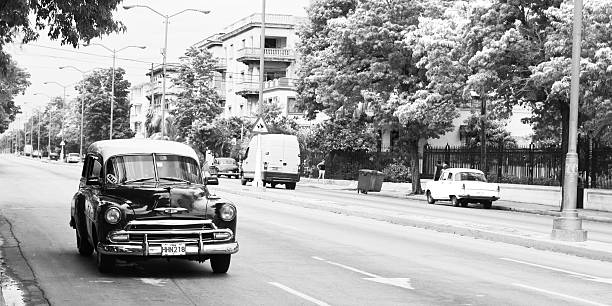 Havana, Cuba - September 7, 2011: A old car circulating circulating Presidents Avenue of Havana, Cuba.