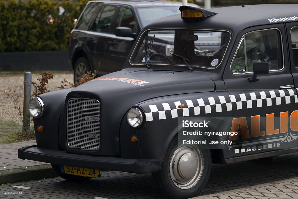 Taxi, Eindhoven, The Netherlands Eindhoven, The Netherlands - February 5, 2013: An old-style taxi is parking in the city center. These kind of old cars are getting to be a rare sight in Europe. Car Stock Photo