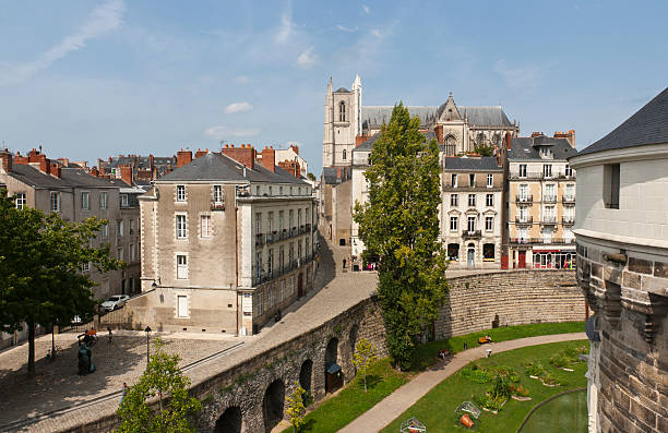 Nantes - The Castle of Brittany Dukes Nantes, France - August 20, 2011: Panoramic view from Tower of Castle of Brittany Duke's. The St. Peter Cathedral on background nantes stock pictures, royalty-free photos & images
