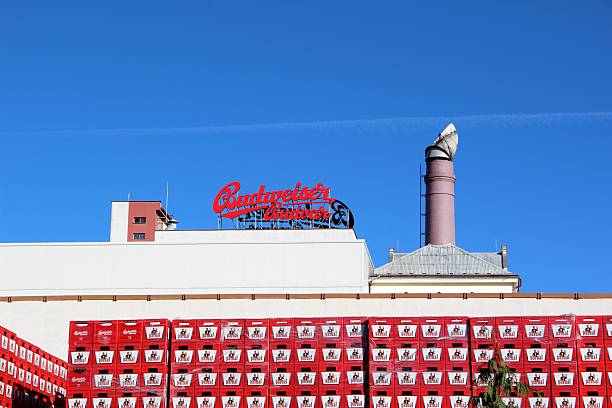 Budweiser Budvar Brewery building Budweis, Czech Republic - November 3, 2012: Budweiser Budvar Brewery building and sign on the roof in Ceske Budejovice (Budweis), Czech Republic, with crates of beer, brand Pardal, in the Budweiser Brewery in Budweis, on a sunny day in November 2012. cesky budejovice stock pictures, royalty-free photos & images