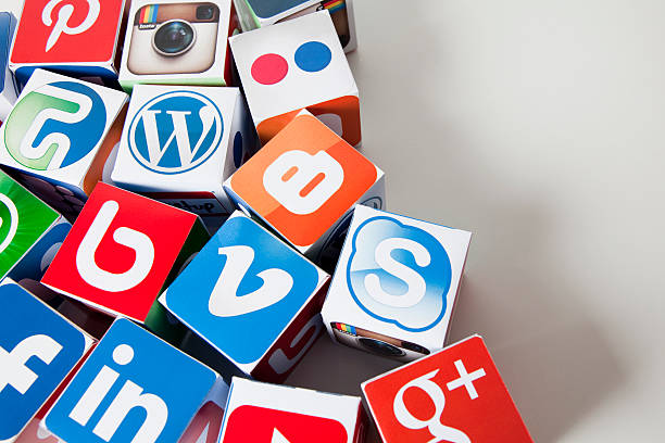 Social media background London, United KIngdom- September 24, 2013: Social media logos printed onto handmade cubes. photographed in a studio. Social media uses web and mobile technology to connect people pinterest stock pictures, royalty-free photos & images