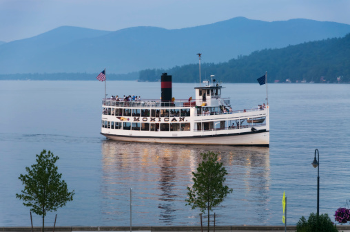 Lake George, New York USA - July 9, 2013: The Lake George Steamboat Company's ship The Mohician returns with tourists after exploring the island of Lake George.