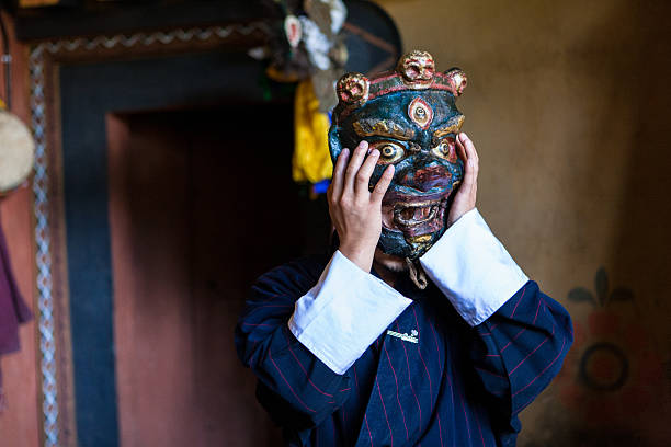 Buthanese man with traditional mask for fire festival in Thangbi stock photo