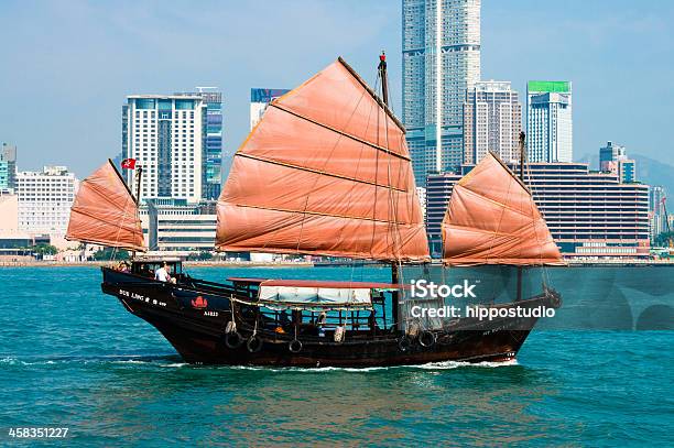 Traditional Chinese Junkboat Sailing Across Hong Kong Harbour Stock Photo - Download Image Now