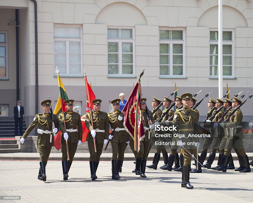 State Day of Lithuania, Vilnius Vilnius, Lithuania - July 6, 2013: The president of Lithuania Dalia Gribauskaite at ceremony in honour of State Day of Lithuania (Coronation of King Mindaugas) takes a military parade on the square of the Presidential Palace  at 6 July 2013 in Vilnius, Lithuania. Adult Stock Photo