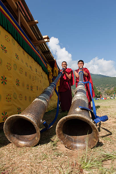 Monks play traditional horn at Wangdi Festival stock photo