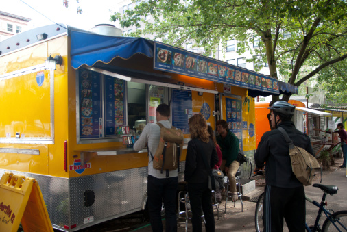 Portland, Oregon, USA - September 20th, 2013 - Several people are lined up at one of downtown Portland, Oregon's food carts.