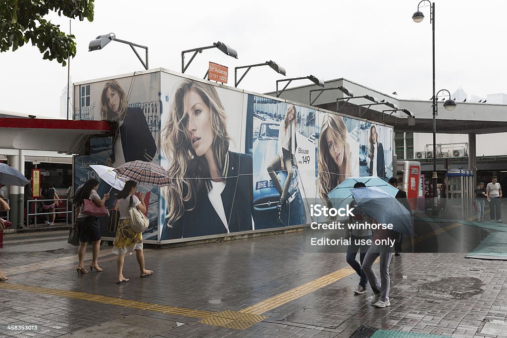 Typhoon Usagi towards Hong Kong Hong Kong, China - September 22, 2013: People holding the umbrellas walk past the street in Tsim Sha Tsui, Kowloon, Hong Kong. Typhoon Usagi towards Hong Kong today. China - East Asia Stock Photo